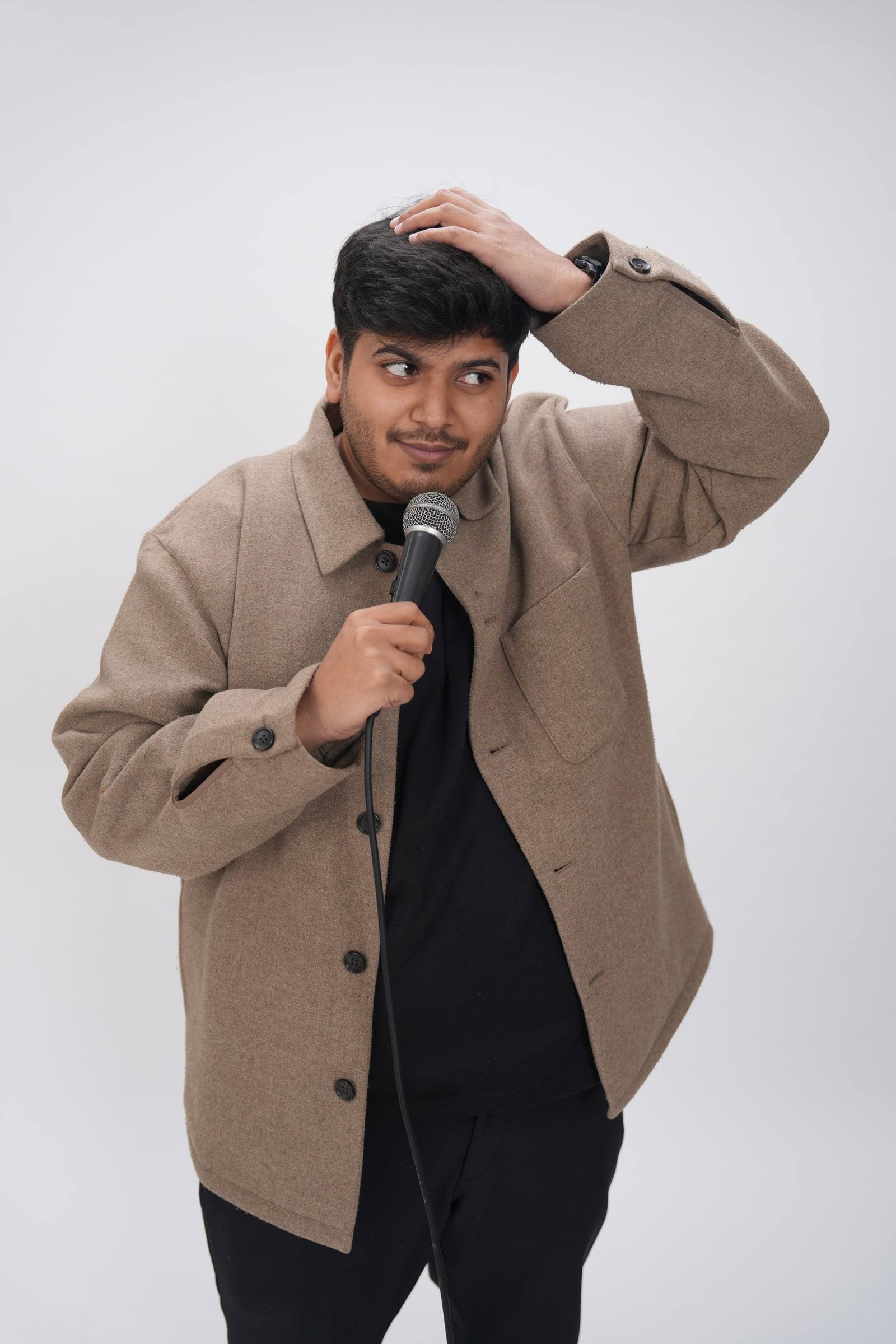 Kaustubh Agarwal with a hand on his head, looking sideways